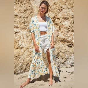 SHORT SLEEVE FLORAL RUFFLE BOTTOM HEM CARDIGAN